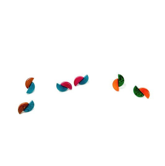 Colorful tagua nut earrings on a white background