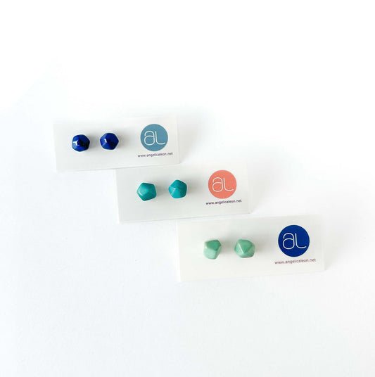 Set of Rock tagua earrings on display with a white background