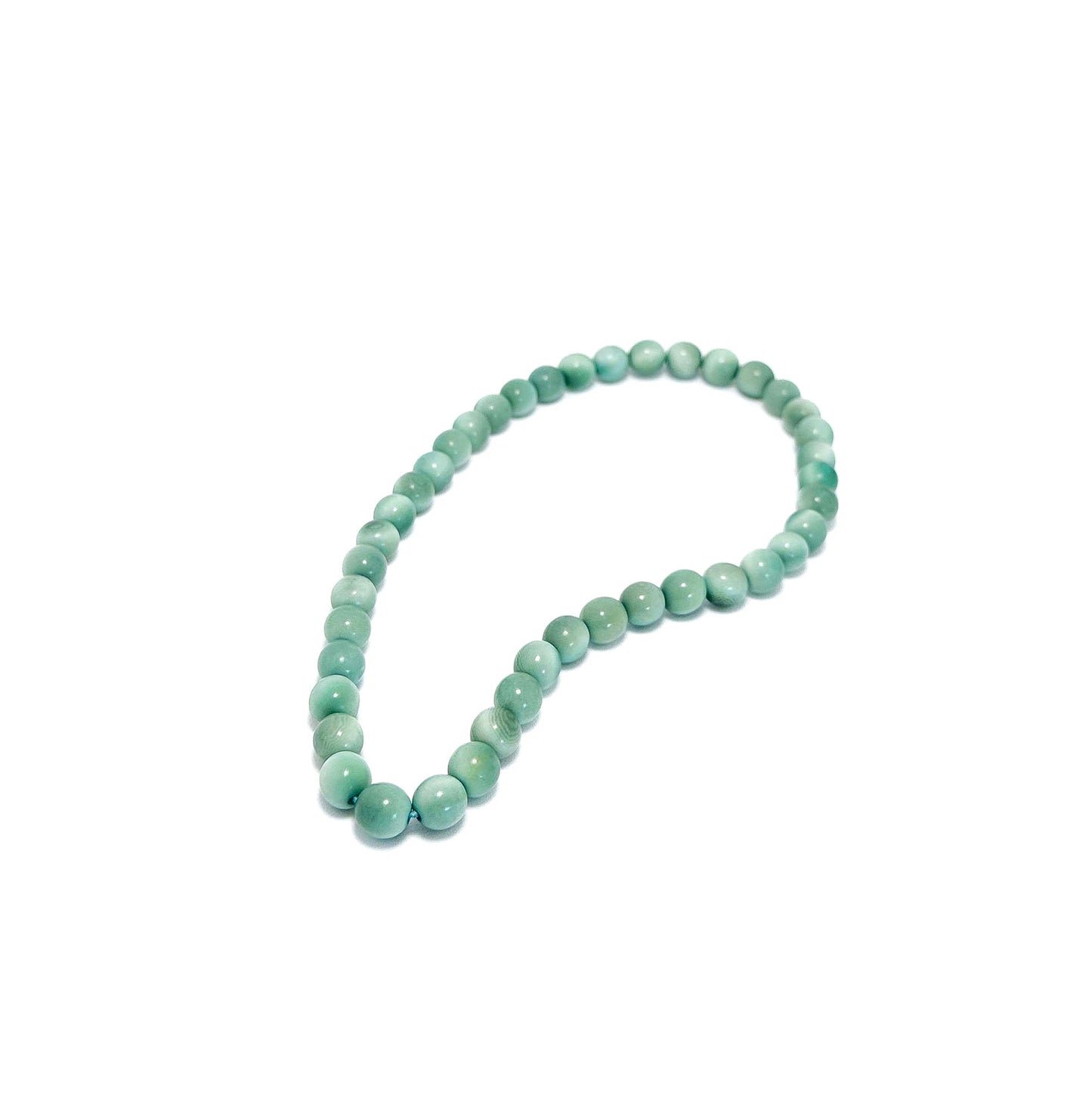 English Green tagua beaded necklace on a white background